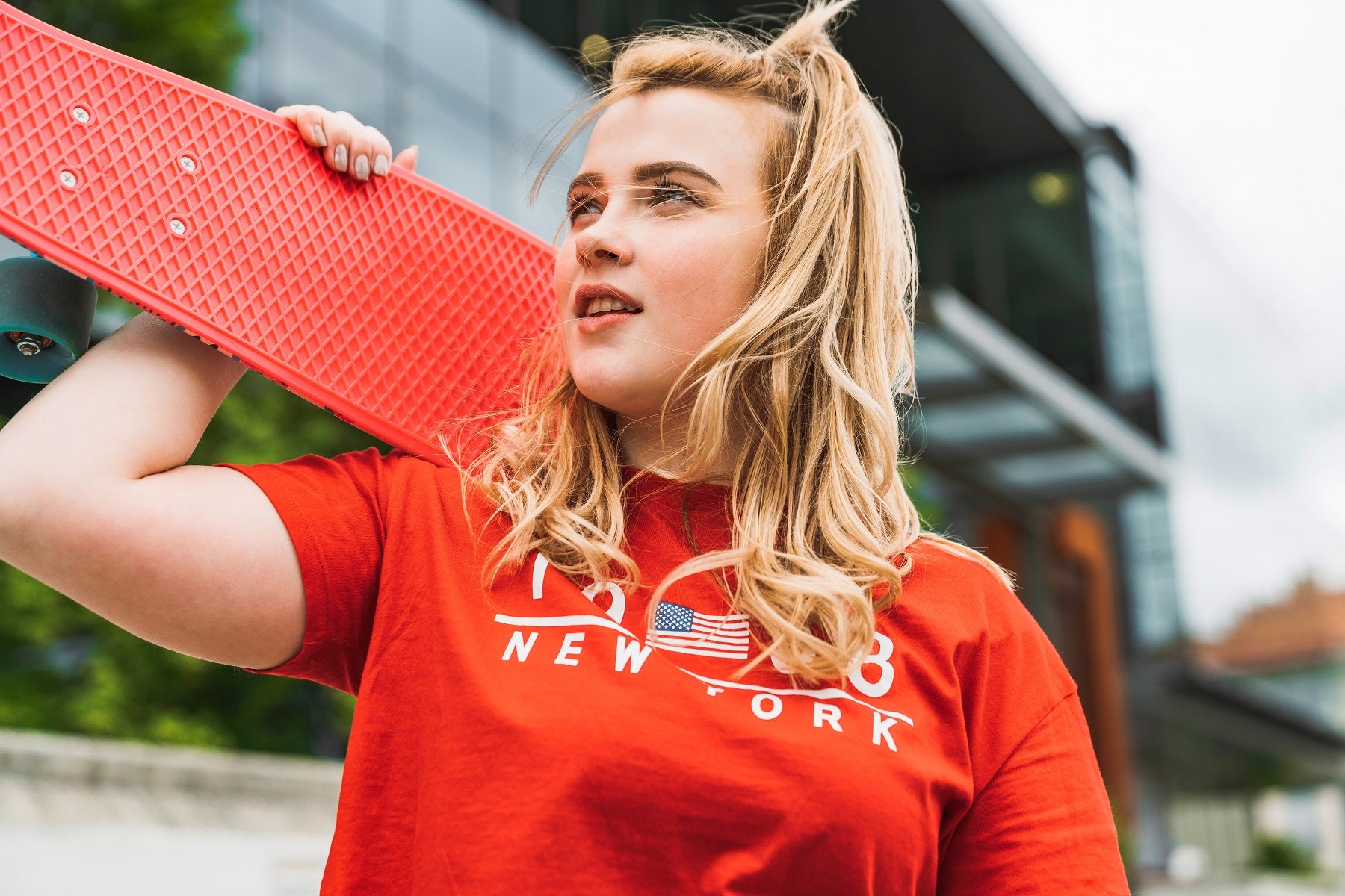 waist up portrait of skater girl with blonde hair at imagewear